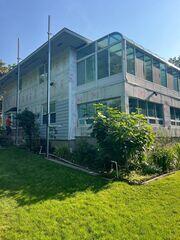 We are now installing the house wrap and installing the flashing around the windows, doors, and other areas moisture may try to come in.