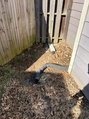 Water Pooling at Fence Line and Downspout