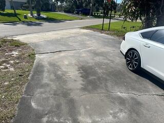 The homeowner's concrete driveway had experienced significant settlement damage over time, resulting in numerous surface cracks and the formation of multiple tripping hazards.