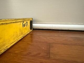 The floors inside the home had developed a noticeable slope, with visible gaps forming between the flooring and the adjacent walls.
