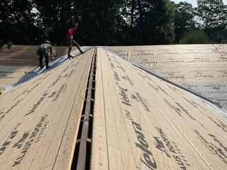 Next, we installed SealoronXT Ice & Water Shield in all the most vulnerable spots on the roof, such as valleys, eaves, and around any skylights or chimneys. This self-adhering membrane helps protect against any leaks, giving the roof an added layer of security where it's needed most. With the...