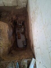 This photo shows the installed push piers, which are driven deep into stable soil to support and lift the foundation. A permanent solution to settlement, these piers restore structural integrity and prevent further shifting.