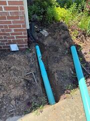 Runnning Drain Beneath Sidewalk
