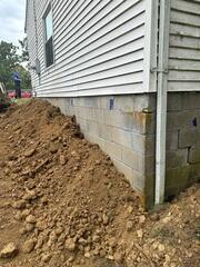 This is what it looked like after we lifted & stabilized this home in Morning View. We covered the piers back up, leaving them hidden under the house.