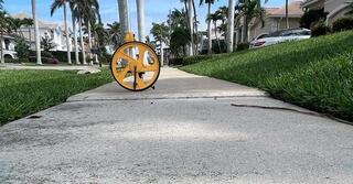 The concrete sidewalk in front of the homeowner's property had settled, resulting in a significant tripping hazard.