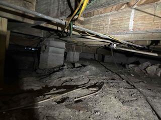During the crawl space inspection, the LRE Design Specialist observed elevated levels of humidity and moisture, which were significantly affecting the flooring above.