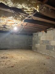 The crawl space was in quite a disarray. Not only was there debris and other items scattered throughout the area, but almost every piece of insulation was falling down due to a buildup of moisture in them and the humidity levels was extremely high!