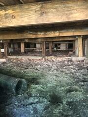 The LRE Design Specialist's inspection revealed that the wooden floor joists lacked sufficient, durable support because the block and wooden piers had settled.