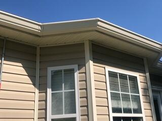 Side of home after gutter installation