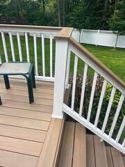 These vinyl posts and railings give the deck a beautiful look and bring out the newly stained decking boards.
