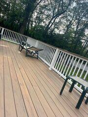 This pressure-treated deck flooring was just recently stained. A beautiful complement to this already gorgeous property.