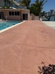 The homeowner noticed sections of their concrete pool deck had settled, leading to an uneven surface and visible cracks.