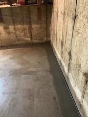 Our WaterGuard drainage system sits below the floor (under the new cement), around the entire perimeter of the basement to capture water seepage.