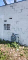 Over time, large cracks of varying patterns formed in the building's exterior walls as the foundation settled and became unstable.