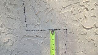 Stair-step cracks in walls are a common indicator of foundation settlement, showing that the foundation has shifted over time.
