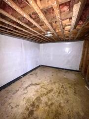 CleanSpace Vapor Barrier was fastened to the basement wall to prevent and block moisture from seeping through. Instead, the moisture will drain down the back side of the liner, directly into the drainage system to be removed from the basement through the sump system.