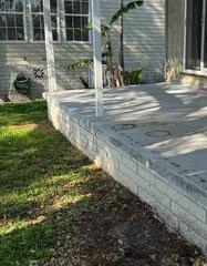 After recently purchasing the home, the homeowner noticed that the back patio had appeared to have settled significantly.