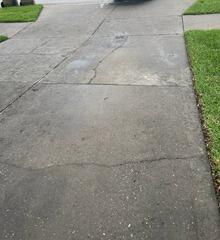 The homeowner's concrete driveway had suffered from extensive damage over time due to the settlement of the underlying soil.