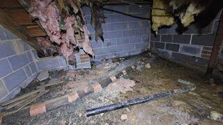 This crawl space in Hillsborough, NC shows clear signs of long-term water intrusion and neglect. The hanging, deteriorated insulation is saturated and falling apart due to prolonged moisture exposure. Debris, exposed pipes, and signs of past flooding litter the ground, indicating poor drainage and ventilation. These conditions can lead to mold growth, wood rot, and compromised indoor air quality, ultimately putting the home's foundation and the residents' health at risk. This image sets the stage for the necessary structural and moisture-related repairs to follow.