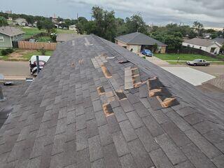 Missing shingles and blown off shingles.