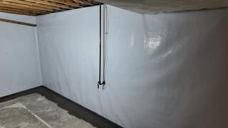Our CleanSpace vapor barrier will provide extra protection against moisture seeping in from the concrete walls. This vapor barrier tucks into our subfloor drainage system through the use of our WaterGuard's wall flanges. This way, any wall leaks will be captured into the drainage system, and head on over to the sump pump.