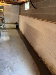 WaterGuard was installed against the floor and walls to collect the water seeping through and direct it to the sump pump for removal.