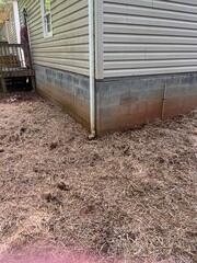 Restored Exterior with Stabilized Foundation and Finished Yard