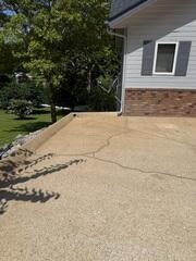 All the cracks in the driveway have been repaired.