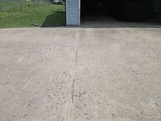 It may be hard to tell from the shadow, but the garage slab is now flush with the driveway.