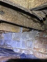 Water damage has taken its toll on this crawl space.