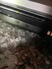 Upon inspecting the homeowner's crawl space, the LRE Design Specialist immediately observed that the floor joists were noticeably sagging due to inadequate support from below.