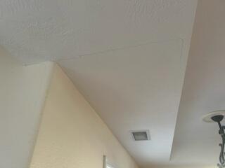 Settlement is causing ceiling cracks.