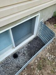 Exterior crack repair and window well reseal