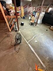 Water infiltration occurred through cold joints and cracks in the foundation slab, where hydrostatic pressure from the surrounding high water table exceeded the capacity of previously applied crack sealants. As a result, the basement remained vulnerable to persistent moisture intrusion, leading to elevated humidity levels and increasing the risk of mold growth and long-term structural damage.