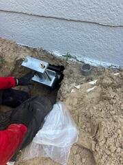 Stabilizing Foundation with Helical Piers