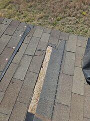 Missing shingles and damaged decking.