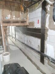 Under the stairs.