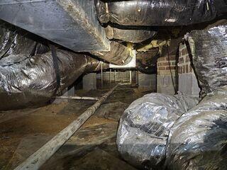Before - Unsealed Crawl Space with High Moisture Risk