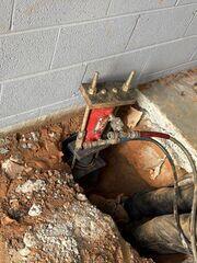 Installing Push Piers for Foundation Stabilization