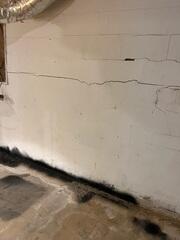 While there are a number of potential causes of cracked and bowing foundation walls, the most common reason is pressure from foundation soils.