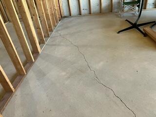Large crack on Concrete Basement floor.