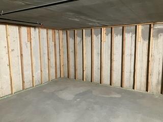 Water-Stained Concrete Walls in Unfinished Basement