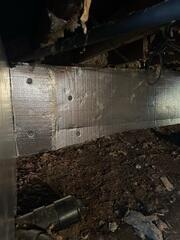SilverGlo insulation panels were installed on the walls of this crawl space to keep the heat in.