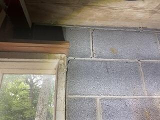 Foundation settlement causing stair-step cracks.