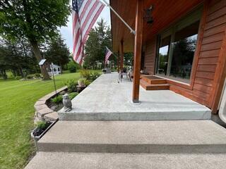 The front porch concrete before the Durastone upgrade, showing a plain, weathered surface ready for a fresh look.