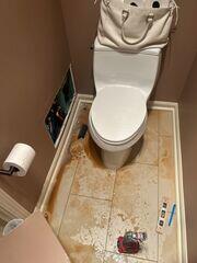 Flooded Water Damages Bathroom Floor