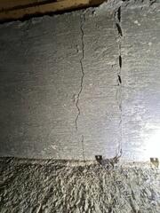 A cracking, settling home foundation.