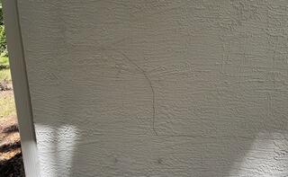 The homeowner noticed small hairline cracks forming in the exterior walls of his home, which gradually worsened over time, prompting him to seek a professional foundation inspection.