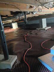 This is our dimpled drainage matting we nailed to the floor. This will help make the vapor barrier we installed over it more comfortable to crawl across. It also helps create channels for moisture to travel through beneath the vapor barrier.