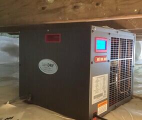 The SaniDry Sedona keeps the humidity in the air of the crawl space low and drains itself into the SmartSump.